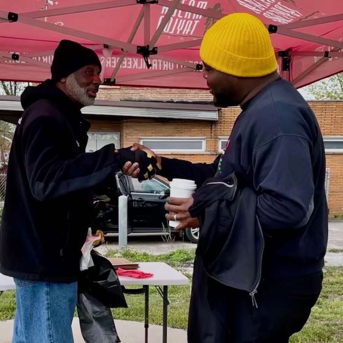 Trailkeepers Board member and Ald Mosley shake hands